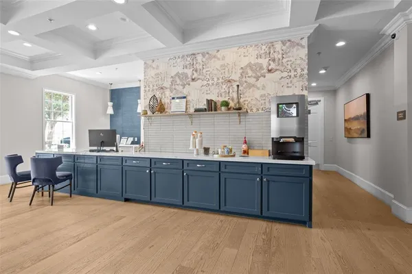 a kitchen with granite countertop a sink cabinets and window