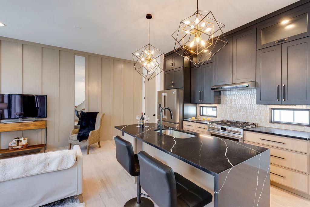 3960 Clairmont Road Chamblee, GA 30341 - Photo 35 of 63 a kitchen with a sink a counter space cabinets and appliances