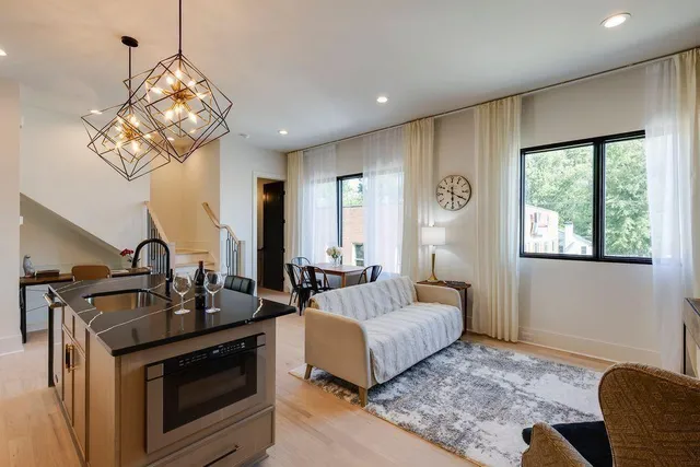 a kitchen with cabinets and wooden floor