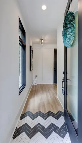 a bathroom with a sink double vanity and glass door