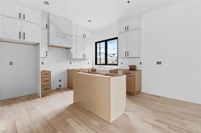 a view of an empty room with glass door