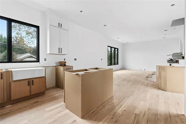 a bath tub sitting next to a blue sink