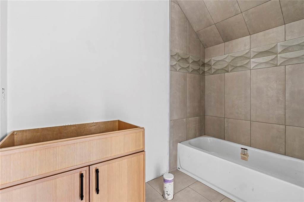 3960 Clairmont Road Chamblee, GA 30341 - Photo 50 of 63 a bathroom with a bathtub