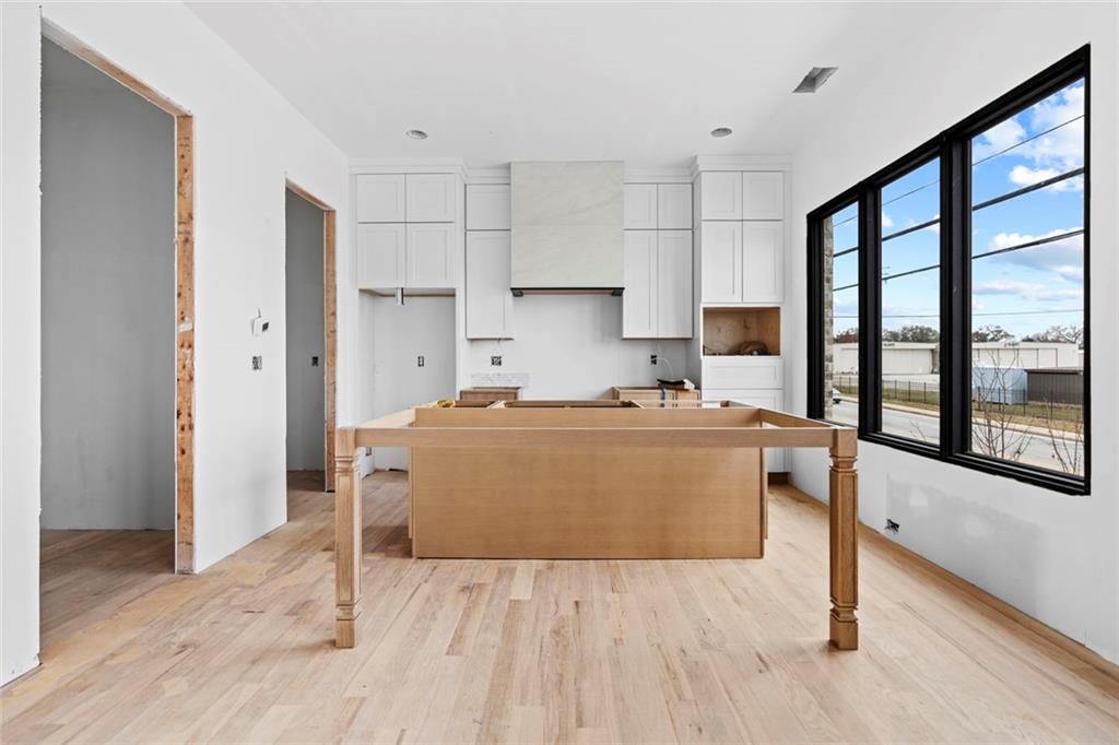 3960 Clairmont Road Chamblee, GA 30341 - Photo 51 of 63 a view of kitchen with furniture and wooden floor