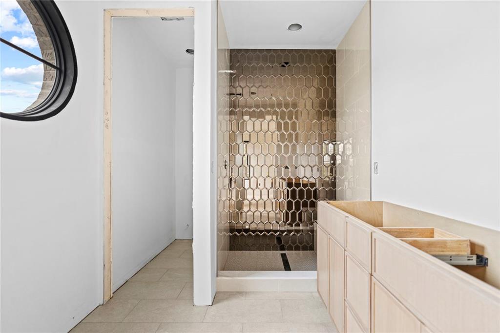 3960 Clairmont Road Chamblee, GA 30341 - Photo 62 of 63 a bathroom with a granite countertop sink and a mirror