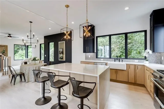 a view of a a dining room with furniture window and wooden floor