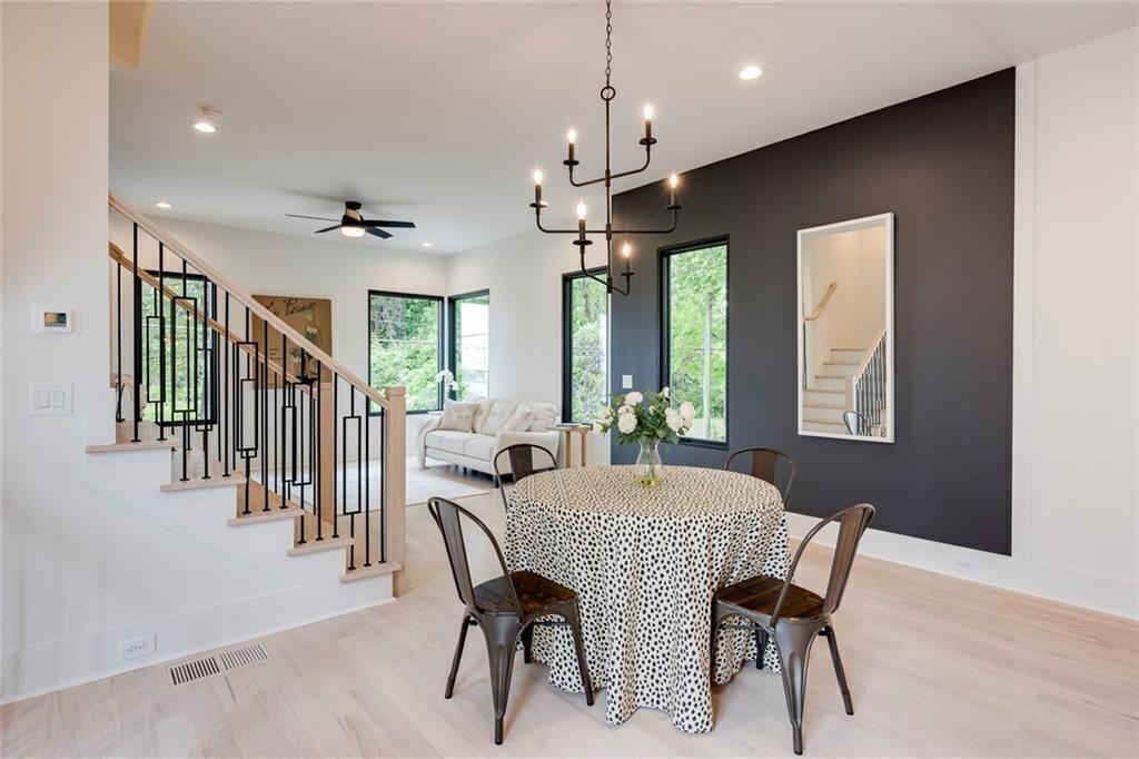 3960 Clairmont Road Chamblee, GA 30341 - Photo 9 of 63 a view of a a dining room with furniture window and wooden floor