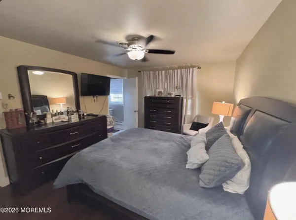 a bed room with a bed and a mirror