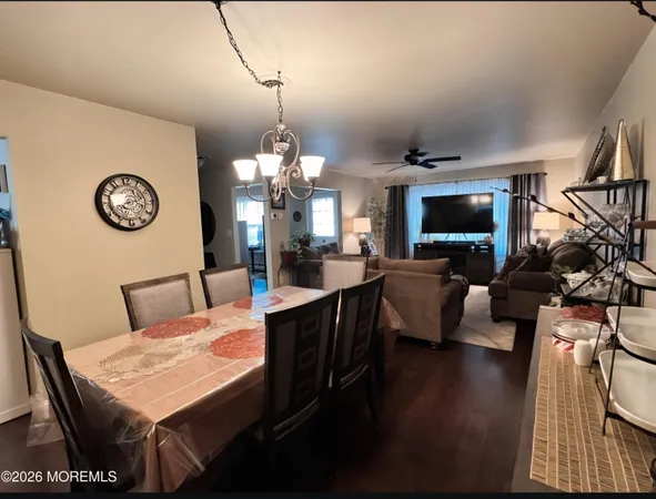 a living room with fireplace furniture and a flat screen tv