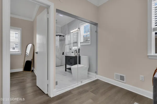 a view of a hallway with seating area