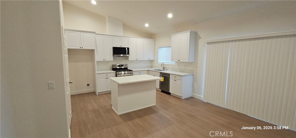13485 Mesquite Road Whitewater, CA 92282 - Photo 2 of 8 a kitchen with white cabinets and stainless steel appliances