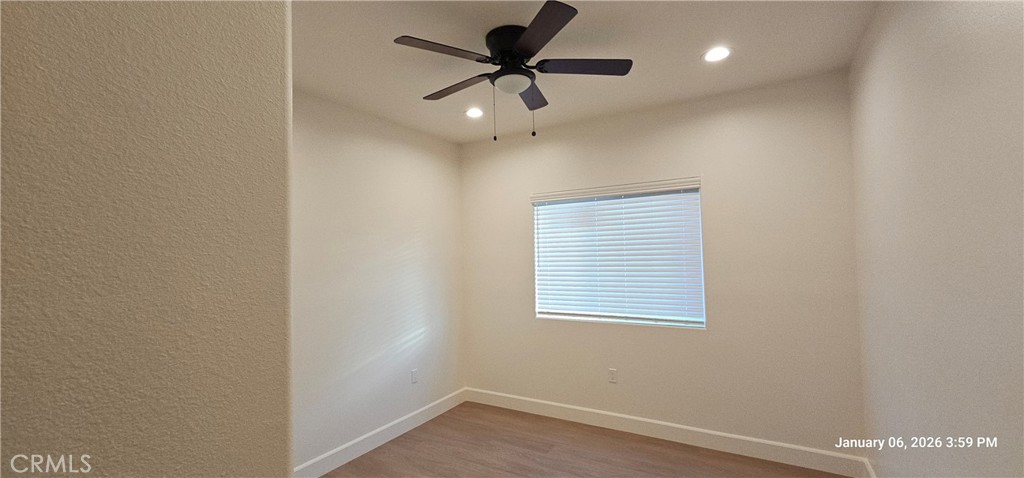 13485 Mesquite Road Whitewater, CA 92282 - Photo 4 of 8 an empty room with a window and a fan