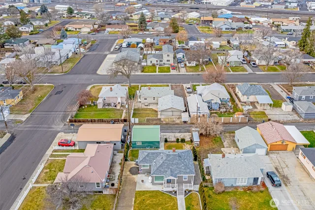 a view of a white building with a swimming pool