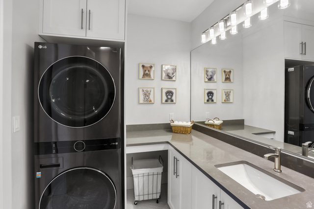 1354 South 800 East Mapleton, UT 84664 - Photo 58 of 129 Laundry area featuring stacked washing machine and dryer and cabinet space