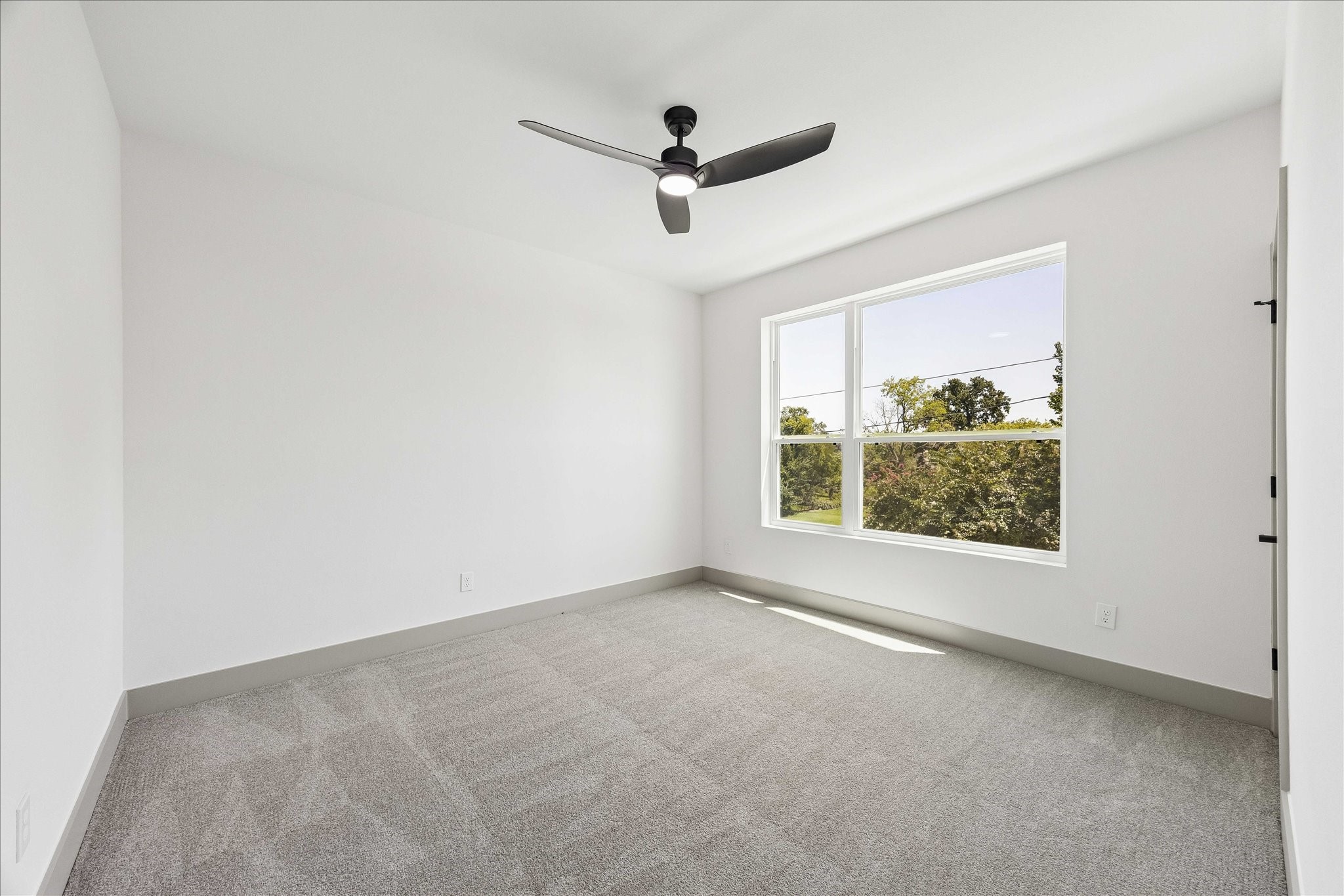 2953 Delafield Street Houston, TX 77023 - Photo 13 of 22 Bright, versatile, and comfortably sized, the additional upstairs bedroom offers flexibility for family, guests, or a dedicated workspace.