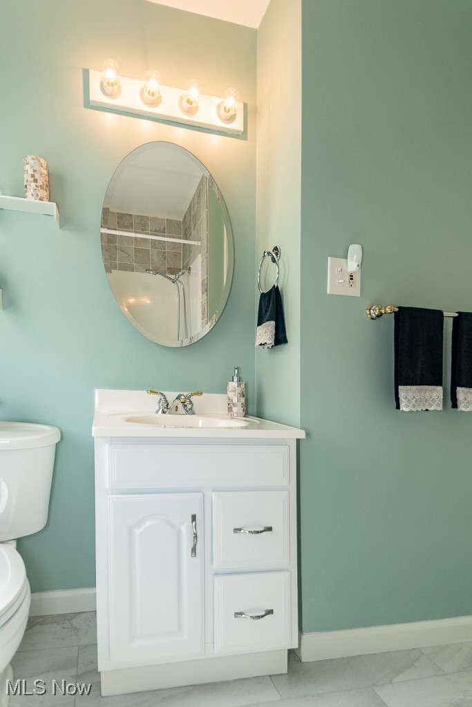 1237 Mayfield Ridge Road Cleveland, OH 44124 - Photo 6 of 38 Bathroom with marble finish floors and vanity