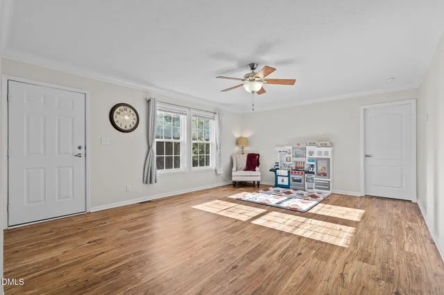 a bed room with a bed and a chandelier