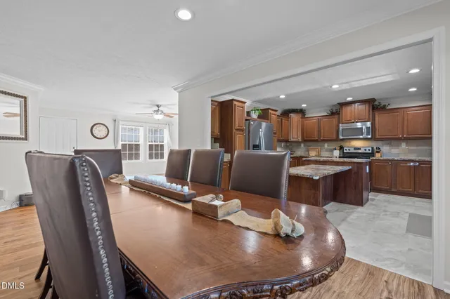 a kitchen with granite countertop stainless steel appliances and wooden cabinets