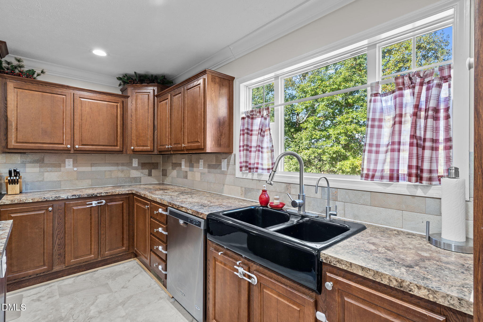 1940 Wadsworth Road Carthage, NC 28327 - Photo 20 of 57 a kitchen with a sink stove top oven and cabinets