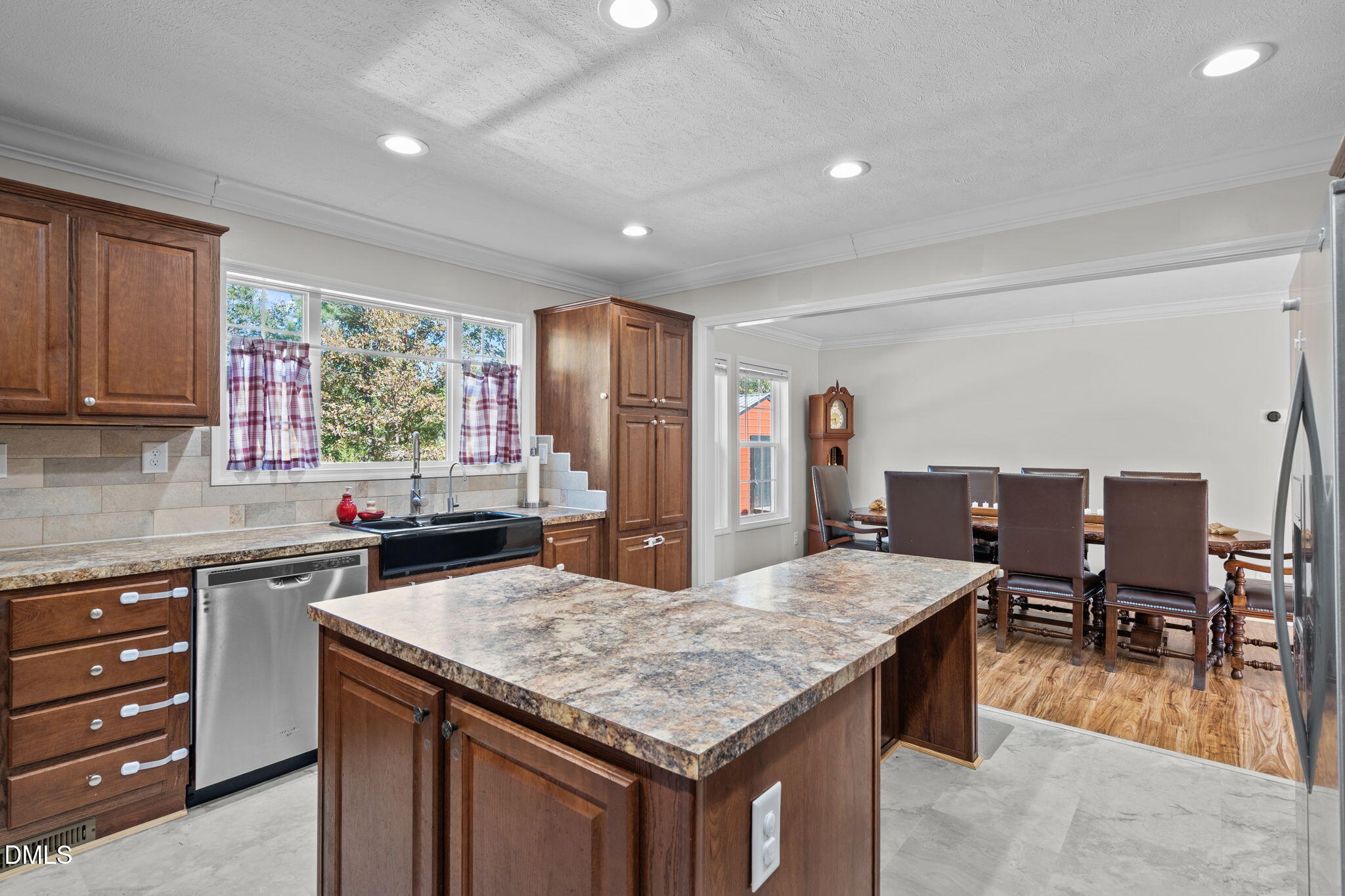 1940 Wadsworth Road Carthage, NC 28327 - Photo 22 of 57 a kitchen with granite countertop kitchen island stainless steel appliances a sink stove and table