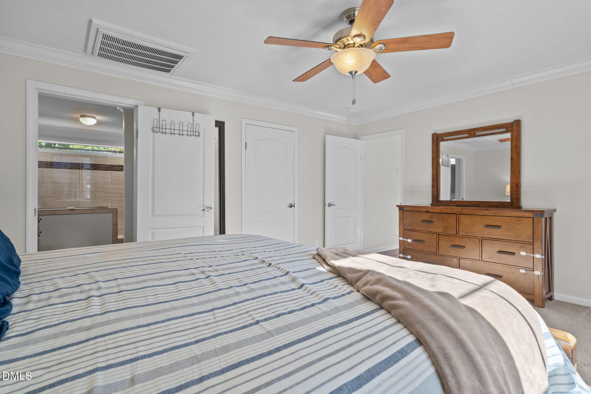 1940 Wadsworth Road Carthage, NC 28327 - Photo 24 of 57 a bedroom with a bed and a chandelier