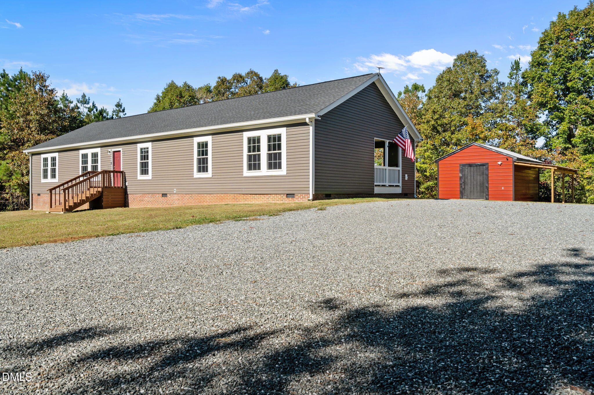 1940 Wadsworth Road Carthage, NC 28327 - Photo 4 of 57 a front view of a house with a yard and garage