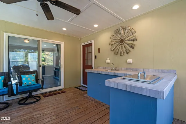 an aerial view of residential house with car parked