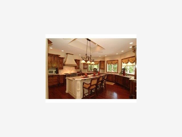 12441 Parker Ranch Road Saratoga, CA 95070 - Photo 4 of 9 a living room with stainless steel appliances kitchen island granite countertop a sink and cabinets