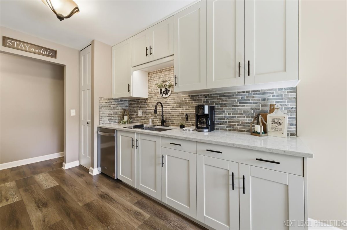 10 Shermead Road Montgomery, IL 60538 - Photo 10 of 30 a kitchen with white cabinets and sink