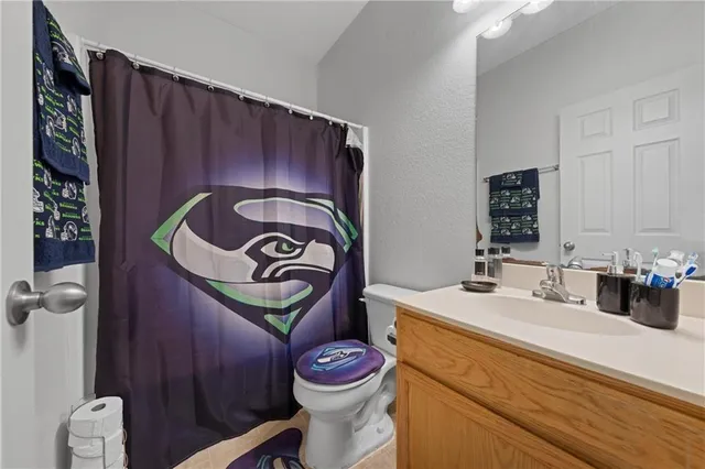 a bathroom with a sink and toilet