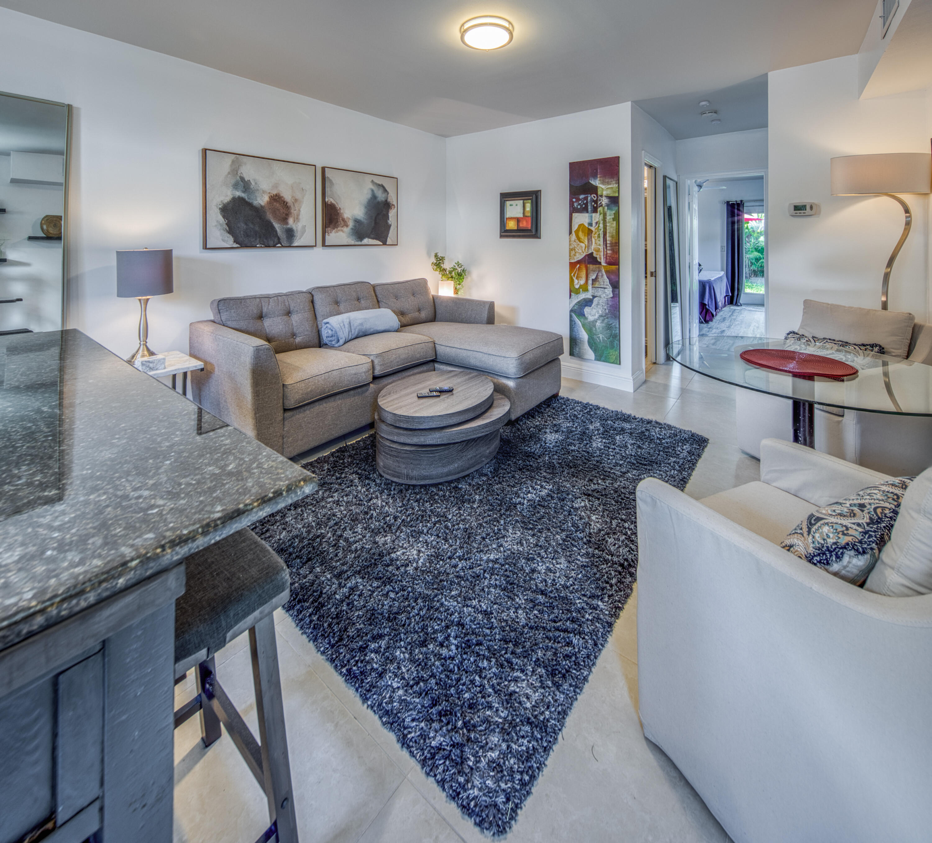 1331 North N Street, Unit GUEST HOUSE Lake Worth Beach, FL 33460 - Photo 1 of 23 a living room with furniture and a couch