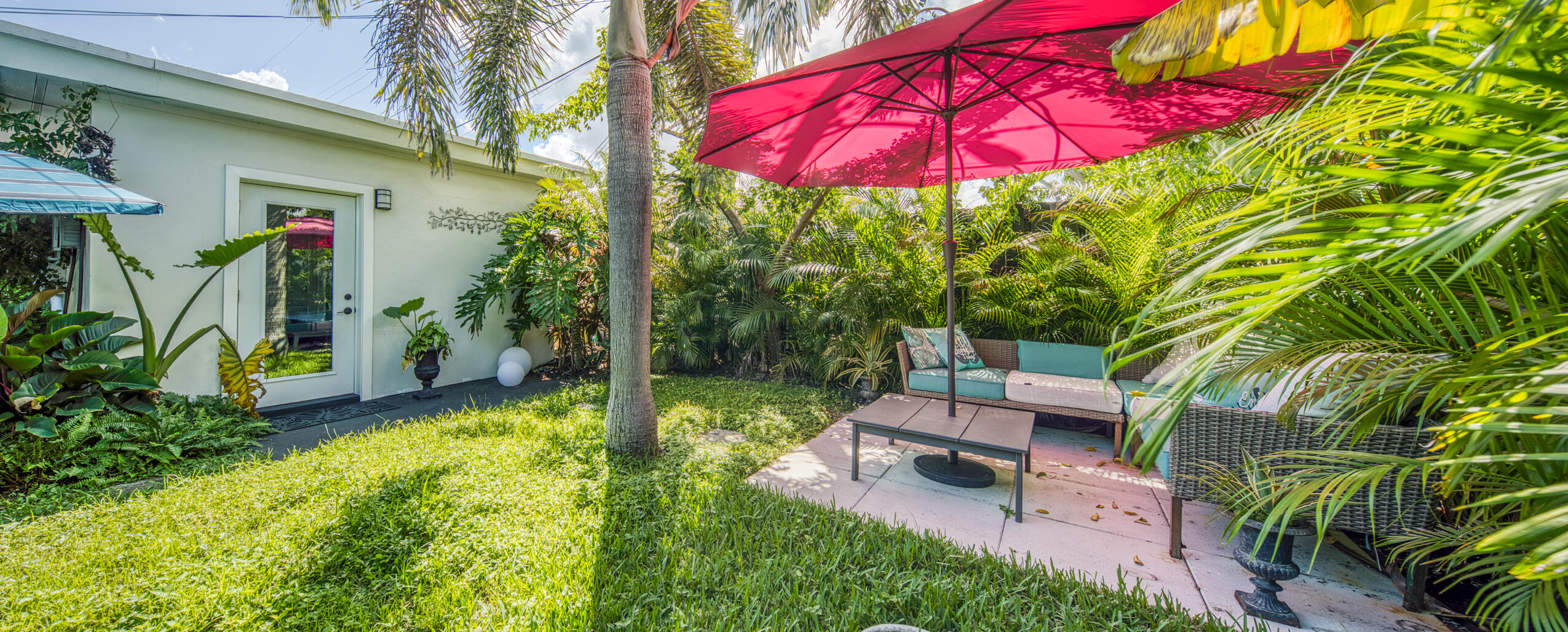 1331 North N Street, Unit GUEST HOUSE Lake Worth Beach, FL 33460 - Photo 14 of 23 a view of a backyard with plants and a patio