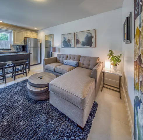 a living room with furniture and a table