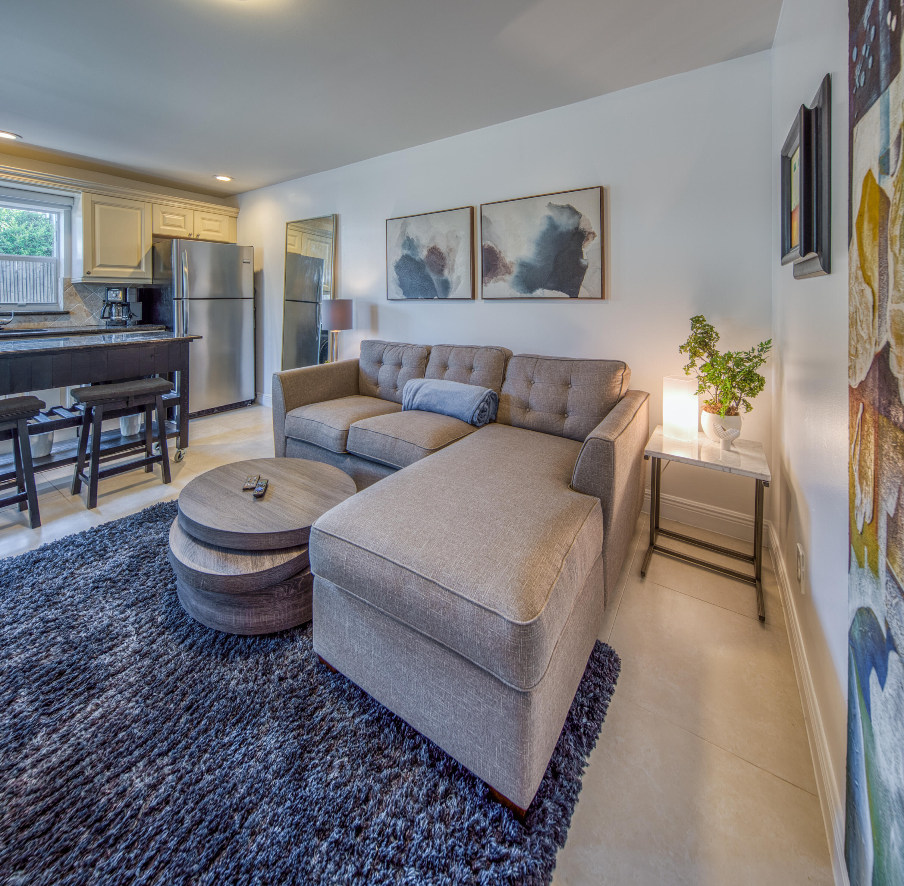 1331 North N Street, Unit GUEST HOUSE Lake Worth Beach, FL 33460 - Photo 16 of 23 a living room with furniture and a table