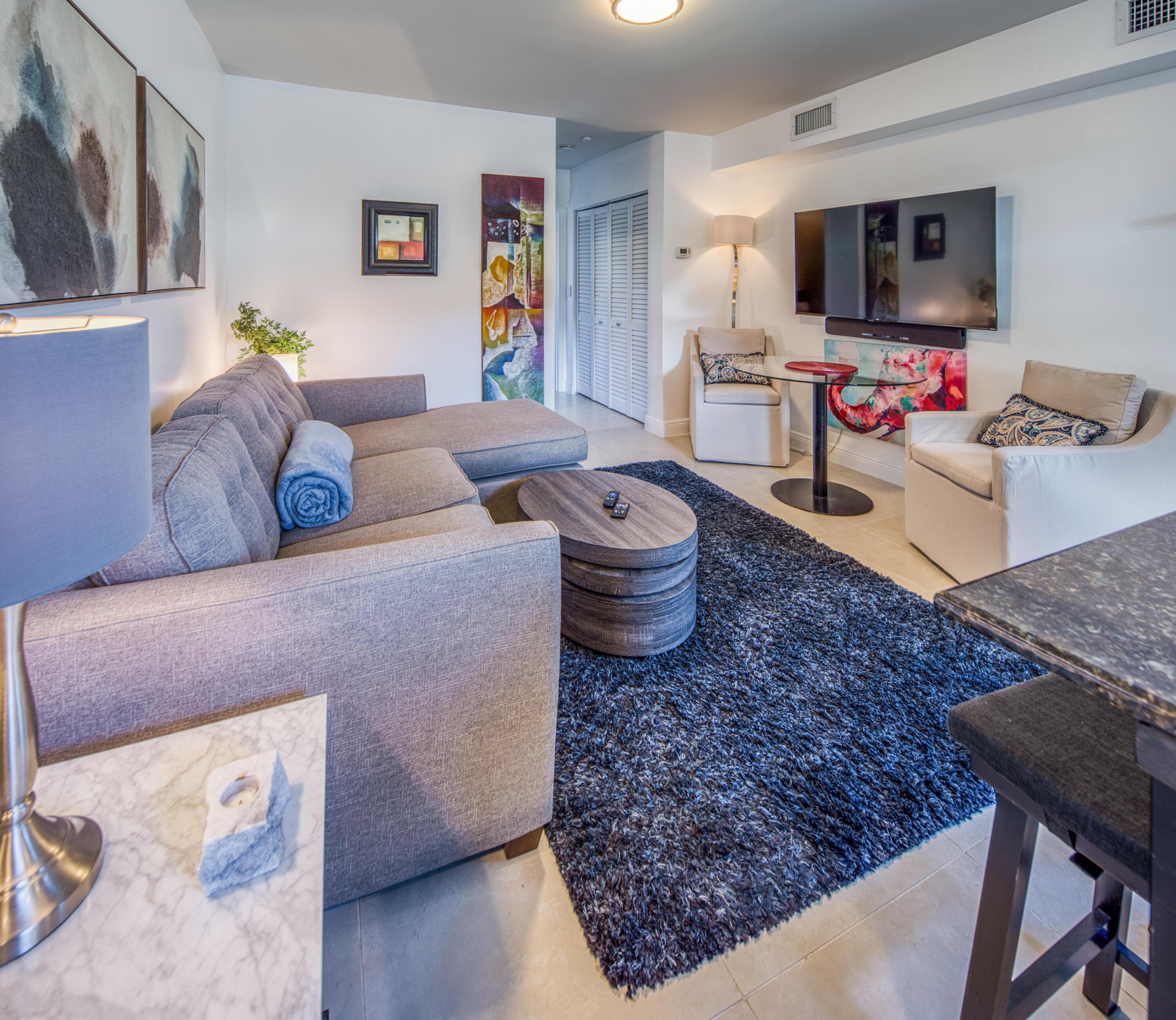 1331 North N Street, Unit GUEST HOUSE Lake Worth Beach, FL 33460 - Photo 17 of 23 a living room with furniture and a flat screen tv
