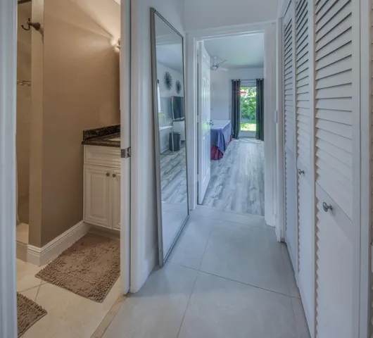 a view of hallway with wooden floor