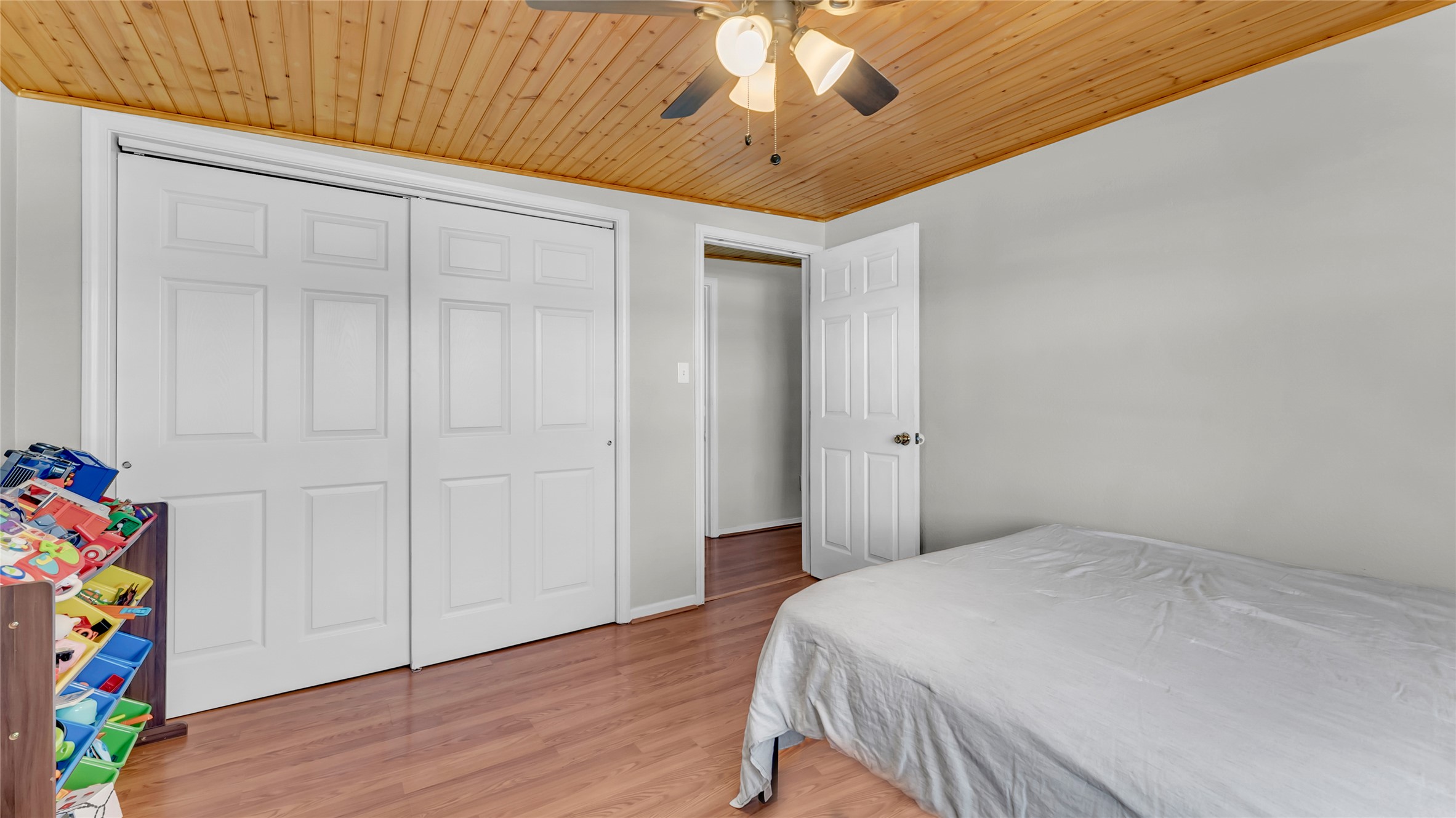 1415 Bee Lane Tow, TX 78672 - Photo 35 of 39 a bedroom with a bed and a chandelier