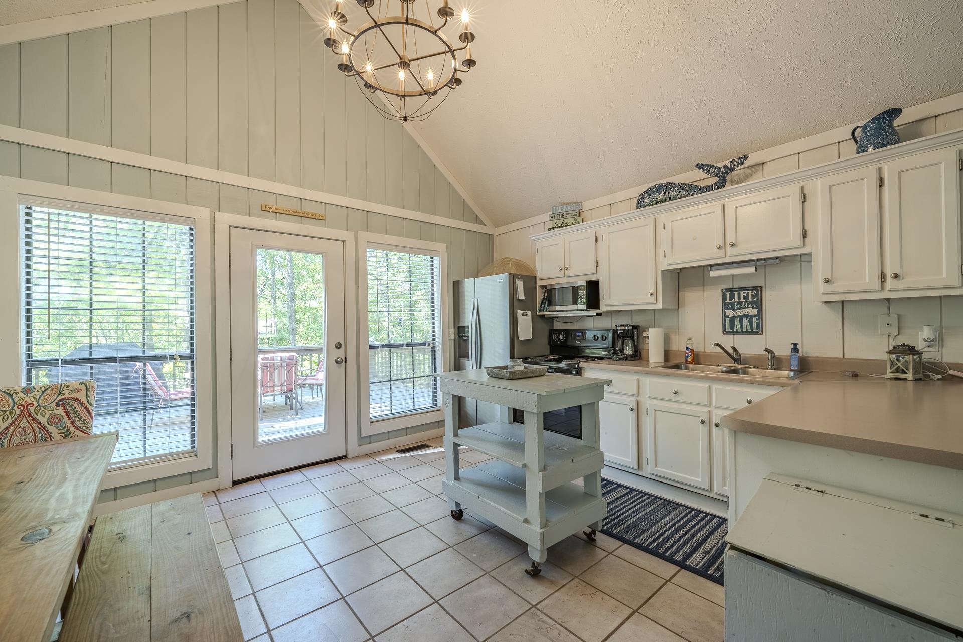 80 Contreau Road Counce, TN 38326 - Photo 10 of 28 a kitchen with stainless steel appliances granite countertop a stove a sink and a refrigerator