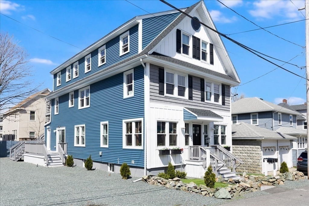 22 Berkley Road, Unit 2 Hull, MA 02045 - Photo 2 of 39 a front view of a building with streets and trees