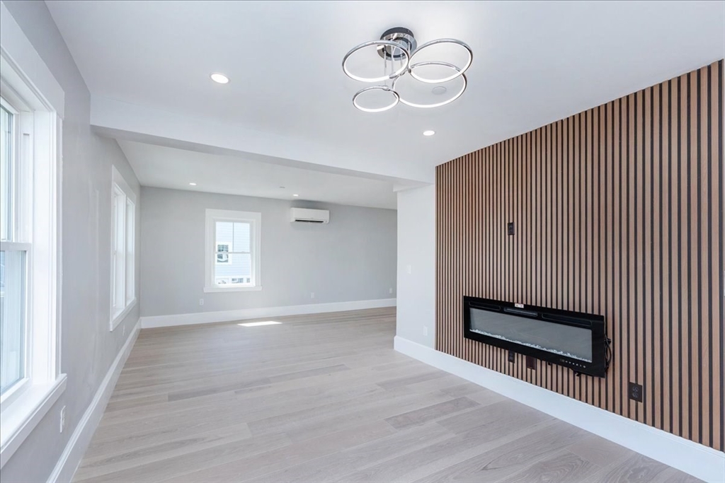 22 Berkley Road, Unit 2 Hull, MA 02045 - Photo 21 of 39 a view of a room with wooden floor and ceiling fan