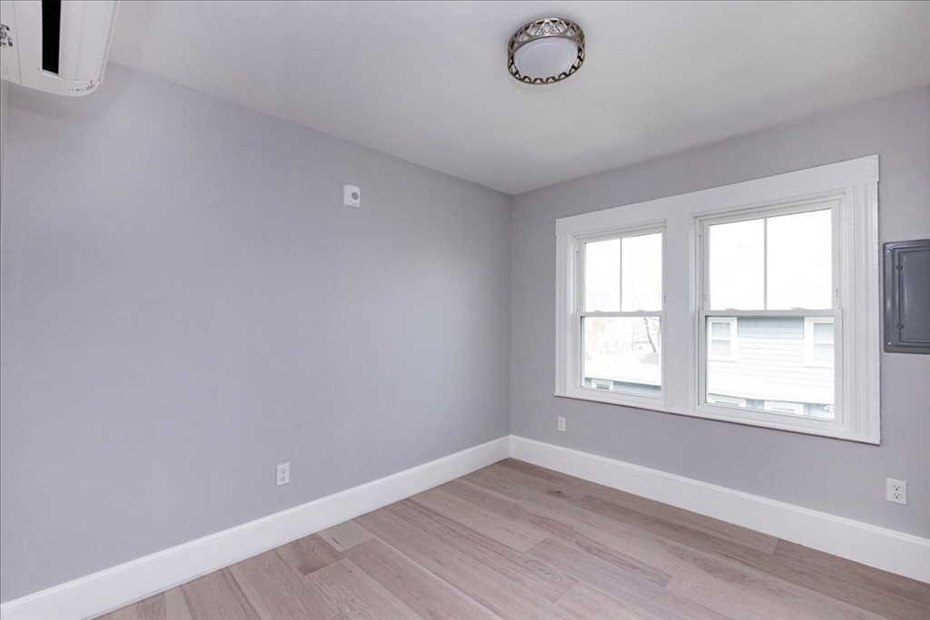 22 Berkley Road, Unit 2 Hull, MA 02045 - Photo 28 of 39 an empty room with a window