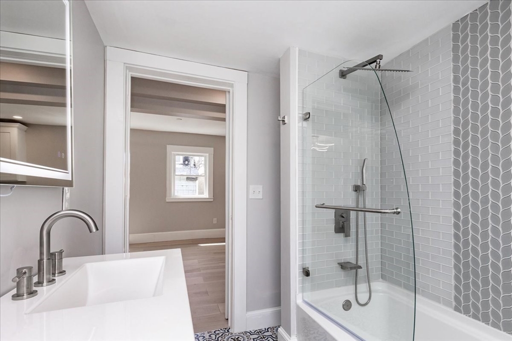 22 Berkley Road, Unit 2 Hull, MA 02045 - Photo 32 of 39 a bathroom with a sink and a shower