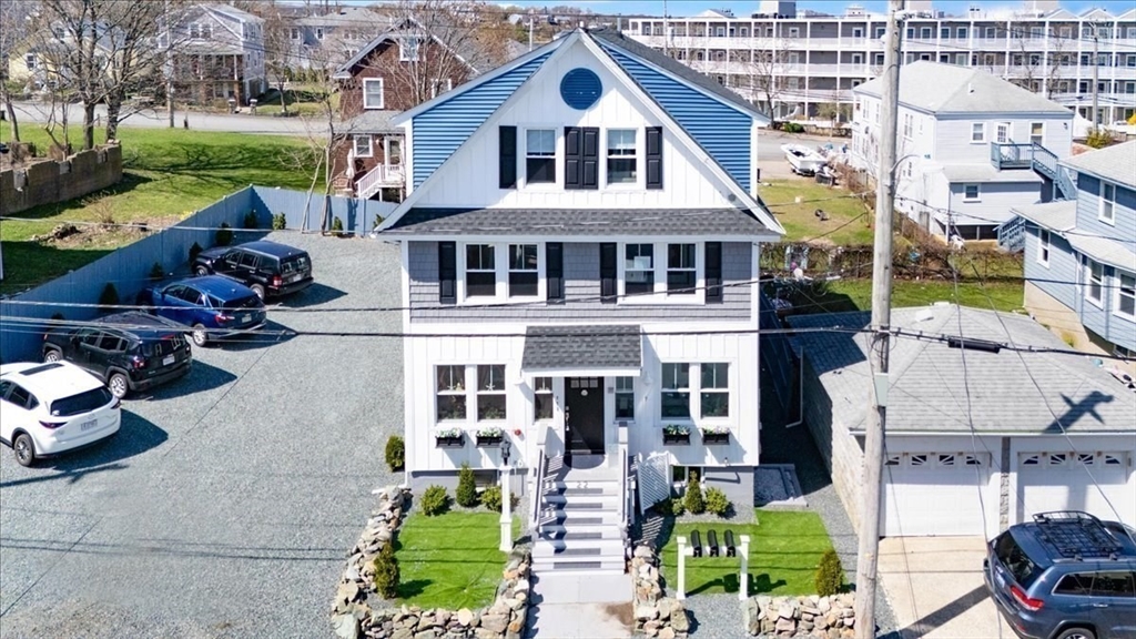 22 Berkley Road, Unit 2 Hull, MA 02045 - Photo 4 of 39 a front view of a house with a yard