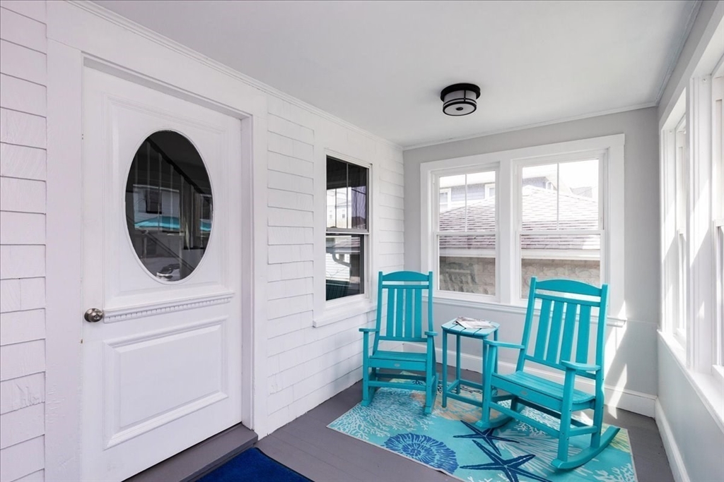 22 Berkley Road, Unit 2 Hull, MA 02045 - Photo 7 of 39 a living room with furniture and a wooden floor
