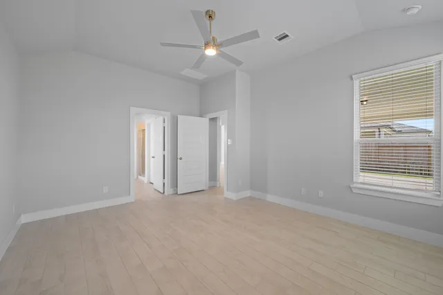 a bathroom with a sink a bathtub a mirror and vanity
