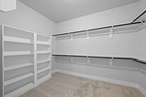 a small space with a window and a walk in closet