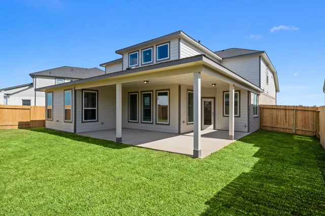 a view of a swimming pool with a table and chairs