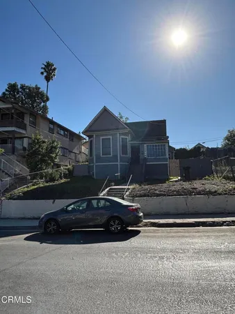 a car parked in front of a house