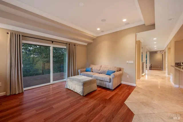 a spacious bedroom with a large bed and a large window