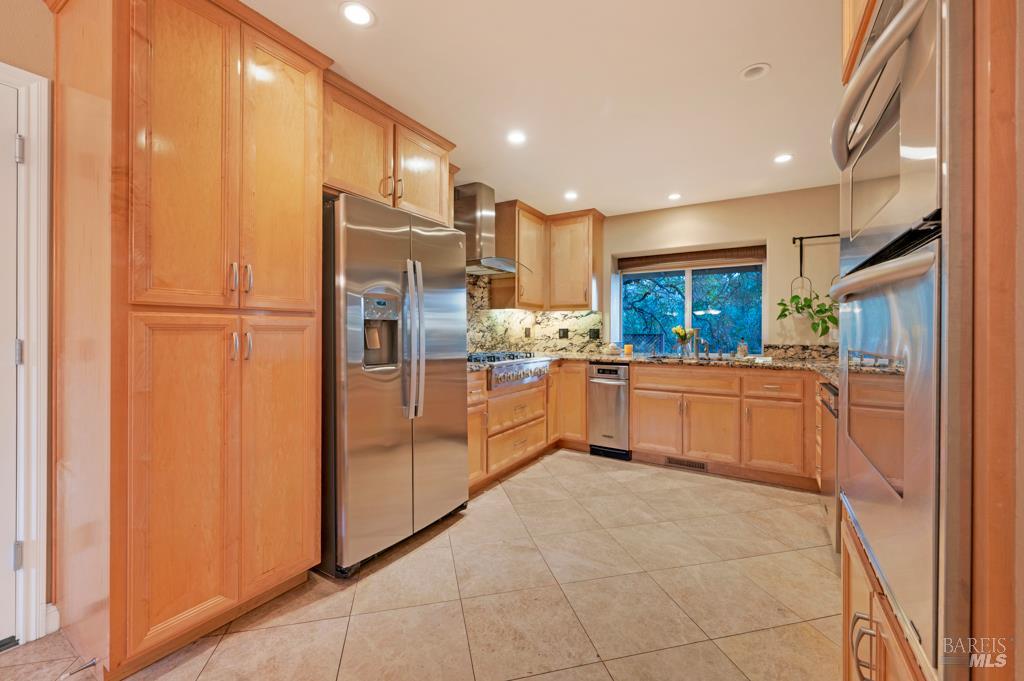 2531 Del Rosa Avenue Santa Rosa, CA 95404 - Photo 14 of 41 a kitchen with stainless steel appliances a refrigerator sink and cabinets
